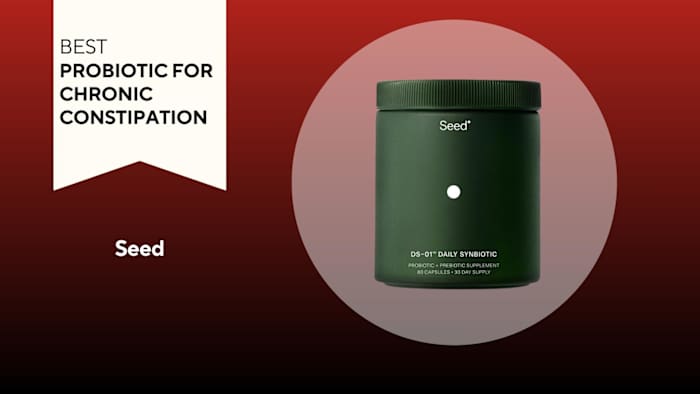 A red and black background with a white banner that reads Best Probiotic for Chronic Constipation next to a green tub of Seed probiotics